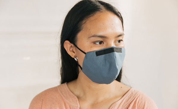 Person wearing the V5 Mask, Pacific Blue, size Small/Medium.